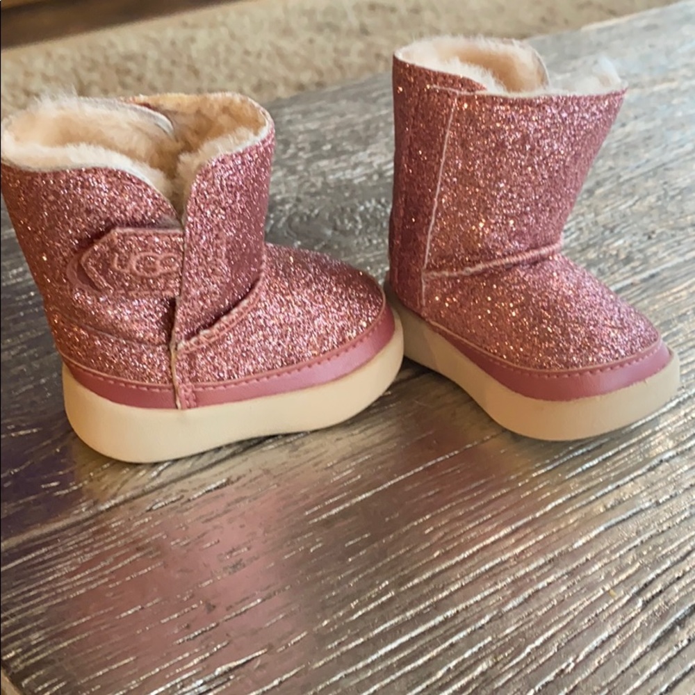 Never worn! Baby size 0/1 pink glitter Ugg’s.